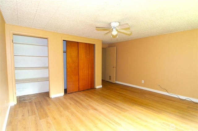 3428 99th Ave NE, Lake Stevens, WA 98258 - unfurnished bedroom featuring light wood-style floors and ceiling fan
