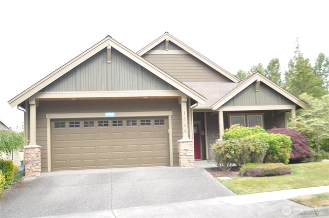 1750 Grand Ave, Mount Vernon, WA 98274 - craftsman-style home featuring driveway, a garage, and stone siding