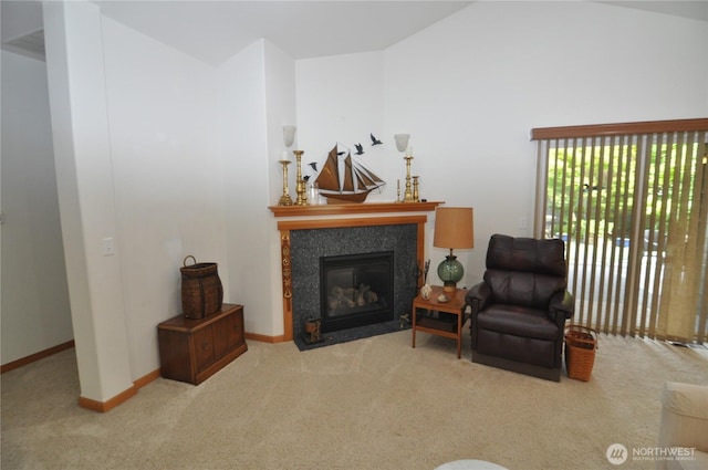 1750 Grand Ave, Mount Vernon, WA 98274 - carpeted living room featuring a fireplace with flush hearth and vaulted ceiling