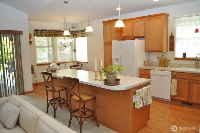 1750 Grand Ave, Mount Vernon, WA 98274 - kitchen with white appliances, light countertops, healthy amount of natural light, and a kitchen island