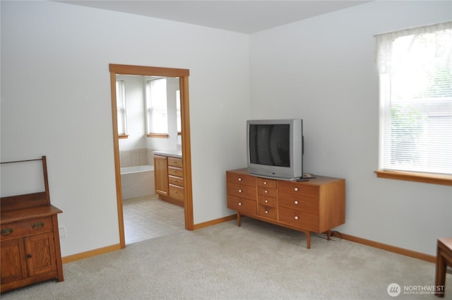 1750 Grand Ave, Mount Vernon, WA 98274 - bedroom with multiple windows, light colored carpet, and ensuite bath