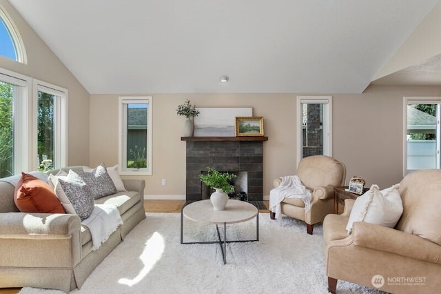 3200 SE Balboa Dr, Vancouver, WA 98683 - living area featuring vaulted ceiling, a brick fireplace, and wood finished floors