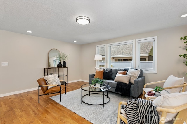 3200 SE Balboa Dr, Vancouver, WA 98683 - living room with wood finished floors, recessed lighting, and a textured ceiling