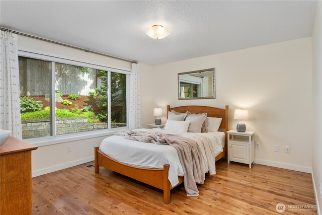 3200 SE Balboa Dr, Vancouver, WA 98683 - bedroom with light wood-style flooring and baseboards
