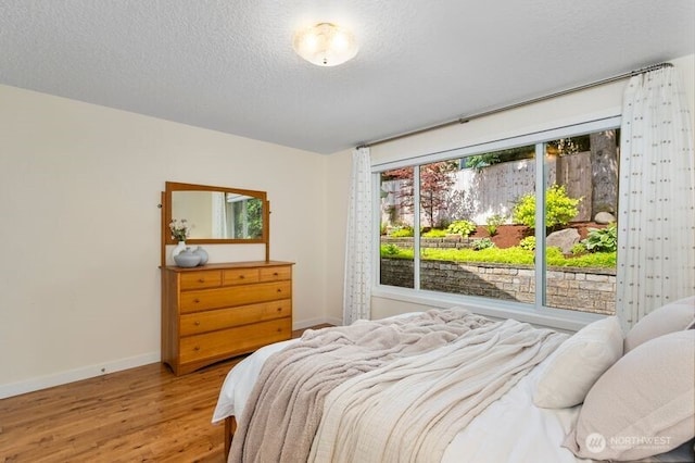 3200 SE Balboa Dr, Vancouver, WA 98683 - bedroom featuring a textured ceiling and wood finished floors
