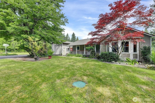 4623 224th St SE, Bothell, WA 98021 - view of front of house with a front yard, covered porch, and an outdoor structure