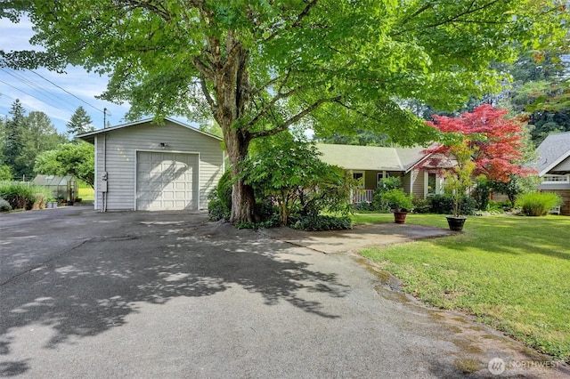 4623 224th St SE, Bothell, WA 98021 - view of front of property featuring a detached garage, a front lawn, asphalt driveway, and an outdoor structure