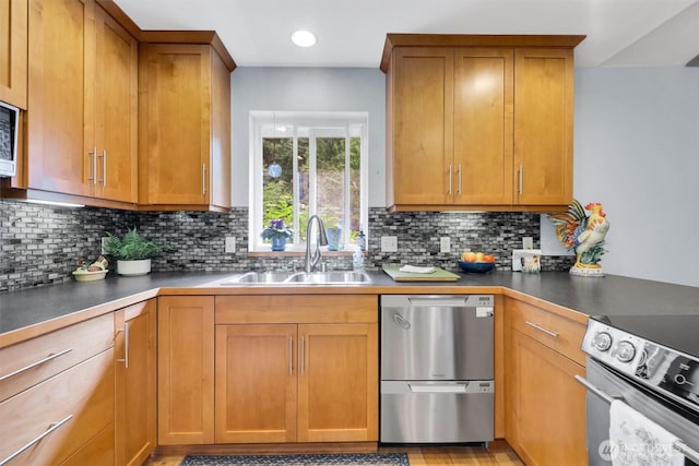 4623 224th St SE, Bothell, WA 98021 - kitchen featuring appliances with stainless steel finishes, tasteful backsplash, brown cabinets, and recessed lighting