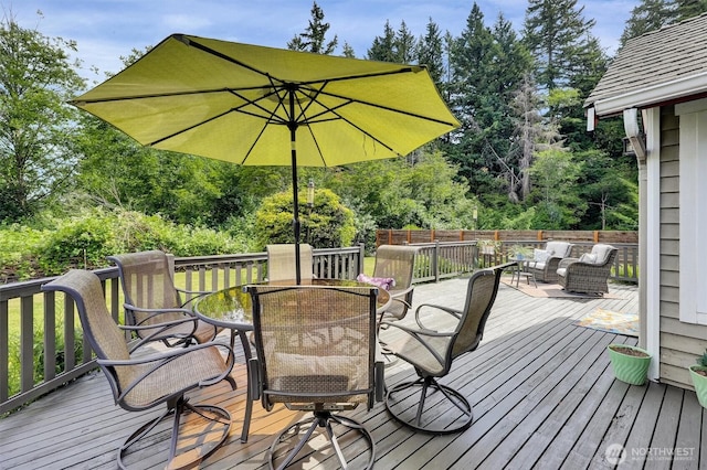 4623 224th St SE, Bothell, WA 98021 - wooden terrace with outdoor dining area and view of wooded area