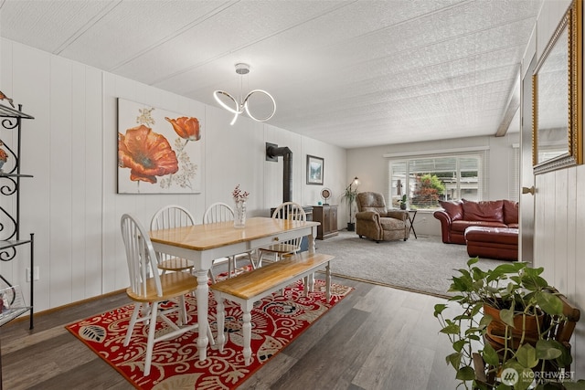 4707 Black Lake Belmore Rd SW Unit 50, Olympia, WA 98512 - dining room with wood finished floors and a wood stove