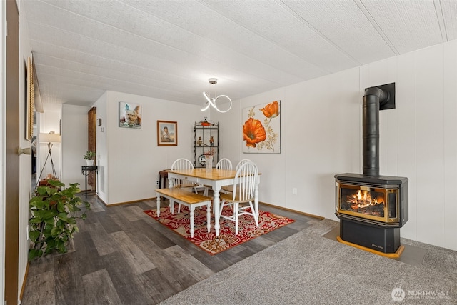 4707 Black Lake Belmore Rd SW Unit 50, Olympia, WA 98512 - dining space featuring wood finished floors and a wood stove