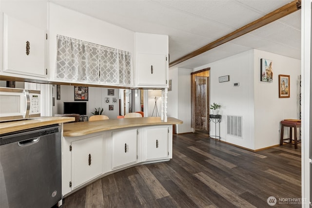 4707 Black Lake Belmore Rd SW Unit 50, Olympia, WA 98512 - kitchen with white microwave, stainless steel dishwasher, dark wood finished floors, and white cabinetry