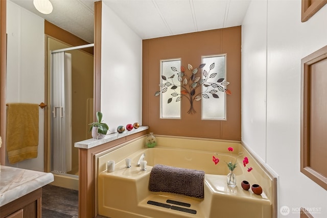 4707 Black Lake Belmore Rd SW Unit 50, Olympia, WA 98512 - bathroom with a bath, a stall shower, and vanity