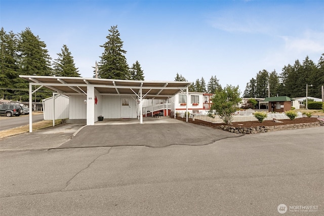4707 Black Lake Belmore Rd SW Unit 50, Olympia, WA 98512 - view of front of property with a detached carport and asphalt driveway