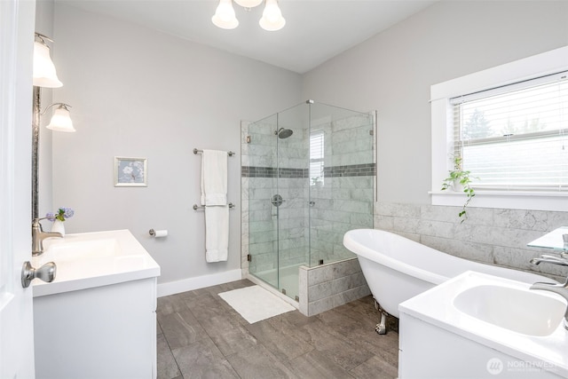 614 16th St SW, Puyallup, WA 98371 - full bath with vanity, a shower stall, a soaking tub, wood finished floors, and tile walls