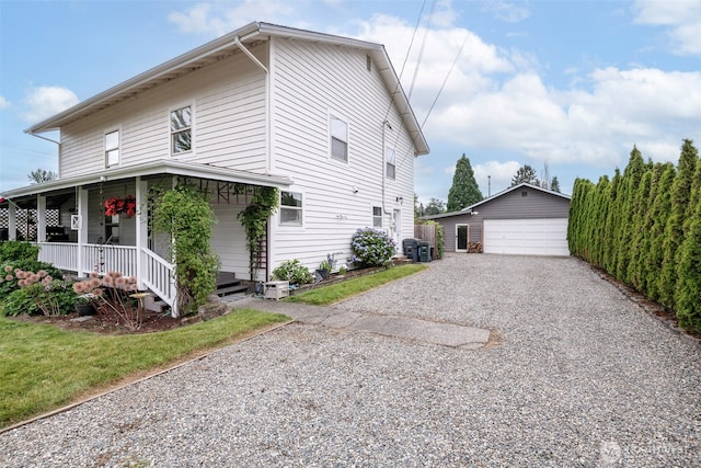 614 16th St SW, Puyallup, WA 98371 - view of side of property featuring an outbuilding, a porch, and a detached garage