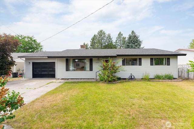 707 Kenwood St N, Omak, WA 98841 - ranch-style house featuring a garage, concrete driveway, and a chimney