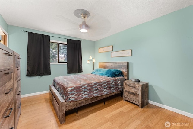 707 Kenwood St N, Omak, WA 98841 - bedroom with light wood finished floors and a ceiling fan