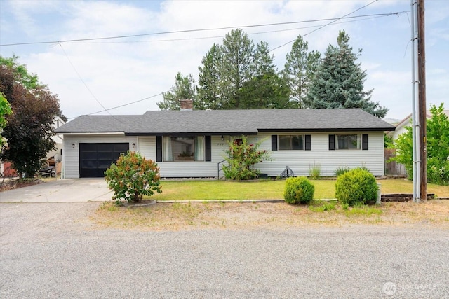 707 Kenwood St N, Omak, WA 98841 - ranch-style house featuring an attached garage, driveway, a chimney, and a front lawn