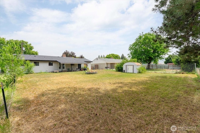 707 Kenwood St N, Omak, WA 98841 - fenced backyard with a storage unit