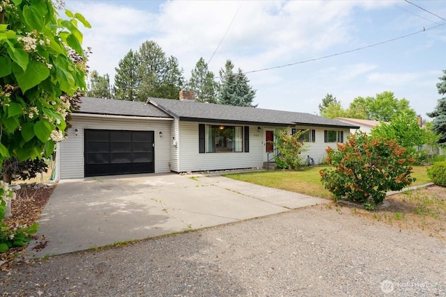 707 Kenwood St N, Omak, WA 98841 - ranch-style home with driveway, a garage, a front lawn, and a chimney