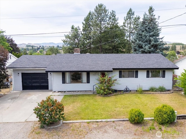 707 Kenwood St N, Omak, WA 98841 - ranch-style house with concrete driveway, a garage, a chimney, a front lawn, and a shingled roof