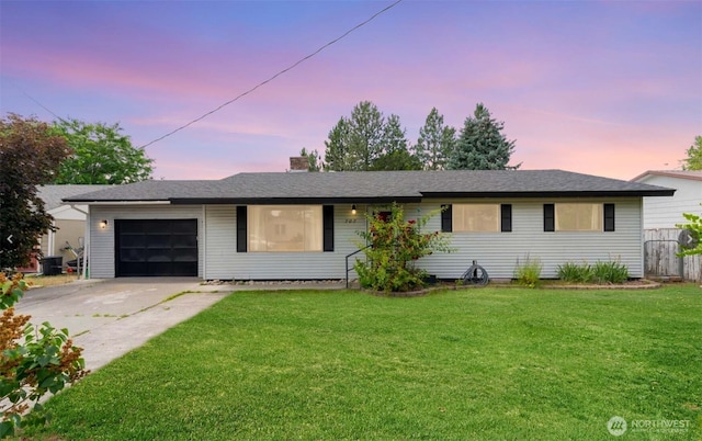 707 Kenwood St N, Omak, WA 98841 - single story home with a garage, concrete driveway, and a chimney