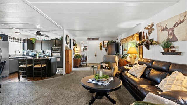 3324 W 19th Ave W Unit 52, Kennewick, WA 99338 - living area with a ceiling fan and light carpet