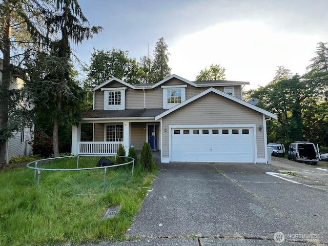 9525 S 221st Pl, Kent, WA 98031 - traditional-style home featuring driveway, covered porch, and an attached garage