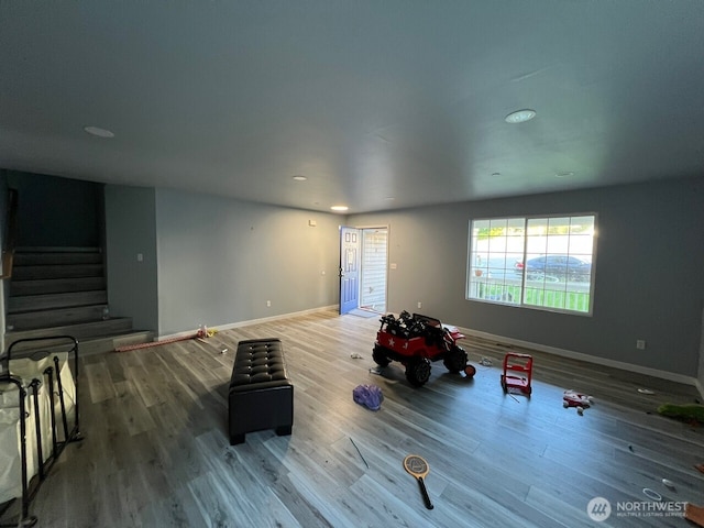 9525 S 221st Pl, Kent, WA 98031 - unfurnished living room with wood finished floors, stairway, and recessed lighting