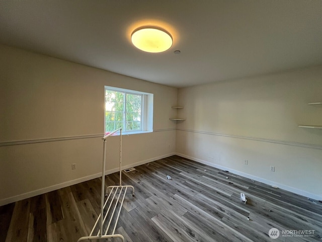 9525 S 221st Pl, Kent, WA 98031 - empty room with wood finished floors and baseboards