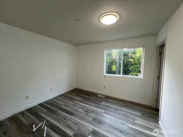 9525 S 221st Pl, Kent, WA 98031 - empty room with wood finished floors and baseboards