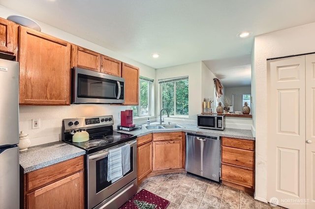 2100 S 336th St Unit M1, Federal Way, WA 98003 - kitchen with appliances with stainless steel finishes, recessed lighting, light countertops, and brown cabinets