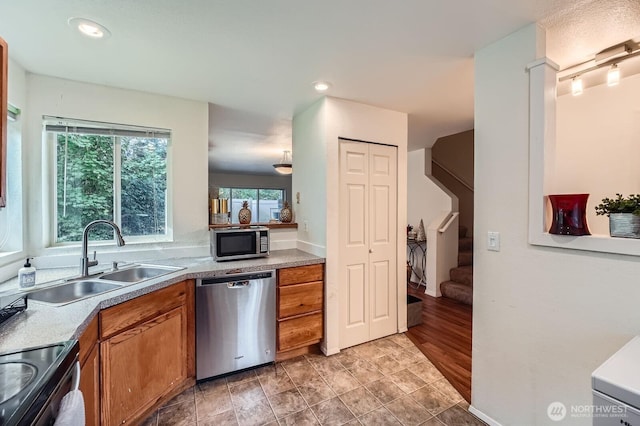 2100 S 336th St Unit M1, Federal Way, WA 98003 - kitchen with stainless steel appliances, brown cabinetry, light countertops, and recessed lighting