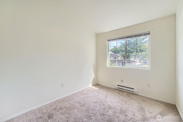 2100 S 336th St Unit M1, Federal Way, WA 98003 - carpeted empty room featuring a baseboard heating unit and baseboards