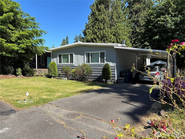 3305 207th Pl SE, Bothell, WA 98012 - manufactured / mobile home with asphalt driveway, a front lawn, and an attached carport