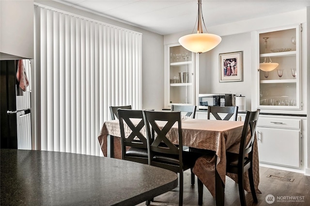 3305 207th Pl SE, Bothell, WA 98012 - dining space featuring wood finished floors and built in shelves