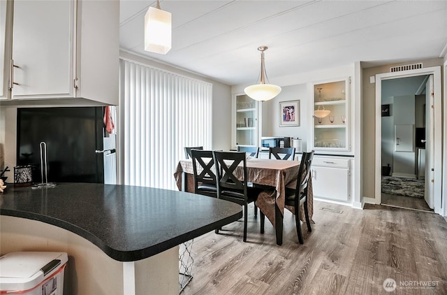 3305 207th Pl SE, Bothell, WA 98012 - dining space with wood finished floors and built in features