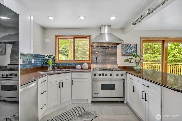4815 46th Ave S, Seattle, WA 98118 - kitchen with stainless steel appliances, ventilation hood, healthy amount of natural light, and recessed lighting