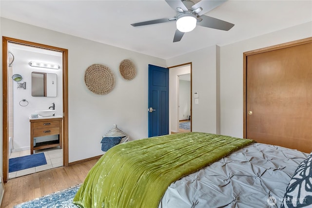 4815 46th Ave S, Seattle, WA 98118 - bedroom featuring light wood-style floors, ensuite bathroom, and a ceiling fan