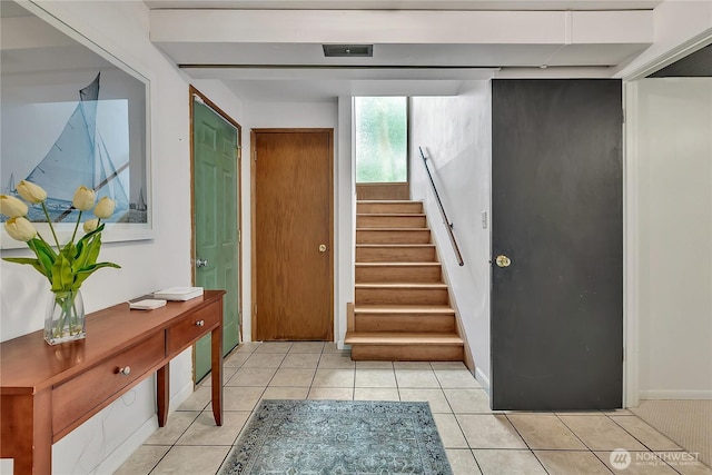 4815 46th Ave S, Seattle, WA 98118 - entryway with stairway and light tile patterned floors