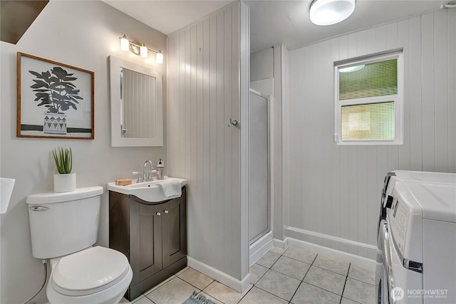 4815 46th Ave S, Seattle, WA 98118 - bathroom with washing machine and dryer, vanity, tile patterned floors, and a stall shower