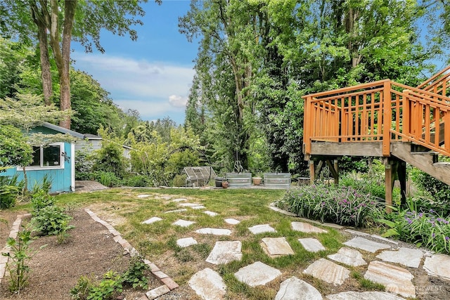 4815 46th Ave S, Seattle, WA 98118 - view of grassy yard featuring a deck and a garden