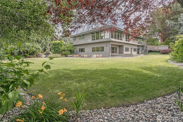 423 Lombard Ln, Wenatchee, WA 98801 - rear view of house featuring stairs, a lawn, and a deck