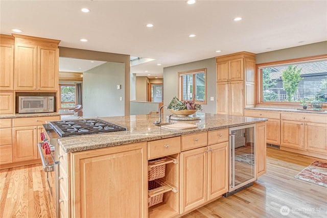 423 Lombard Ln, Wenatchee, WA 98801 - kitchen with light brown cabinets, wine cooler, and recessed lighting