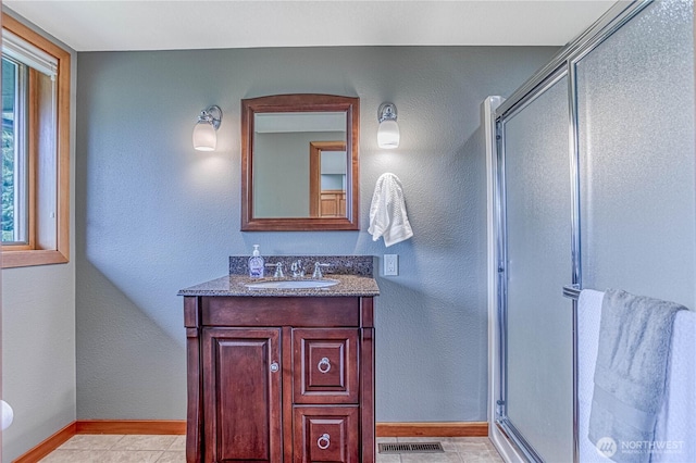 423 Lombard Ln, Wenatchee, WA 98801 - bathroom featuring a stall shower, vanity, and tile patterned flooring