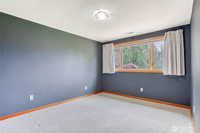 423 Lombard Ln, Wenatchee, WA 98801 - empty room featuring carpet flooring, a textured wall, and a textured ceiling