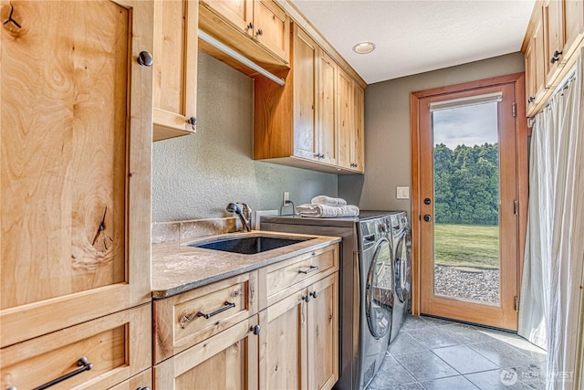 423 Lombard Ln, Wenatchee, WA 98801 - laundry area with cabinet space, independent washer and dryer, and light tile patterned floors