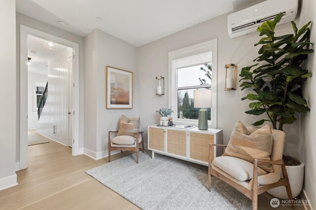18814 99th Ct NE Unit A, Bothell, WA 98011 - living area featuring a wall unit AC and light wood-style floors