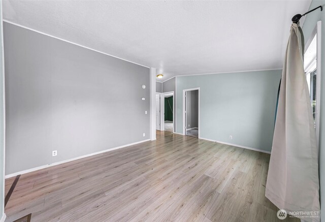 700 N Reed St Unit 101, Sedro Woolley, WA 98284 - unfurnished room with wood finished floors and baseboards
